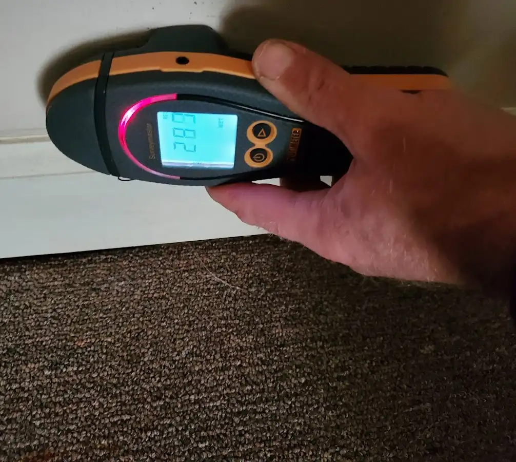 Moisture detection at baseboard during Storm Damage Restoration in Vero Beach South